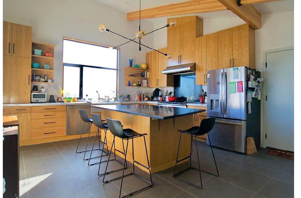Kitchen with island and bar seating, The Woodhill House