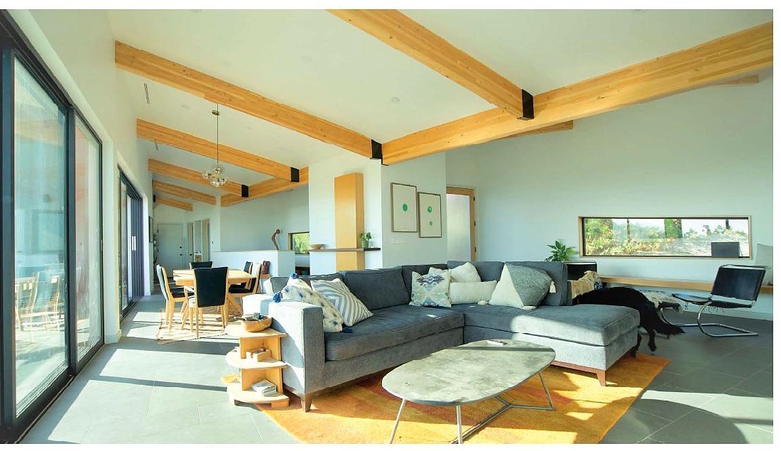 Open-plan living with exposed beams